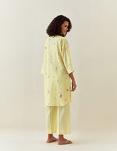 Yellow botanical print mid length cotton linen kurta with yoke placket