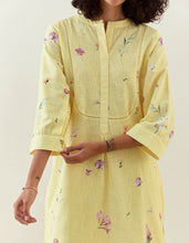 Yellow botanical print mid length cotton linen kurta with yoke placket