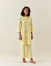 Yellow botanical print mid length cotton linen kurta with yoke placket